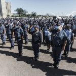 Police make community rescuers at Stilfontein sign indemnity forms before helping trapped miners