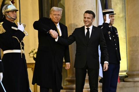 Trump says world ‘a little crazy’ as he meets Macron in Paris