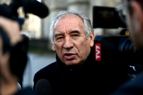 French PM moves to force budget through divided parliament