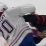 Juraj Slafkovsky scores a goal against Ridly Greig