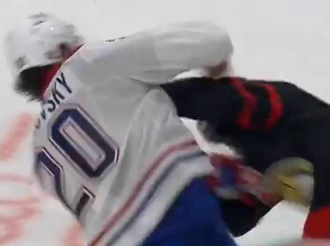 Juraj Slafkovsky scores a goal against Ridly Greig