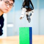 AI enables paralyzed man to control robotic arm with brain signals